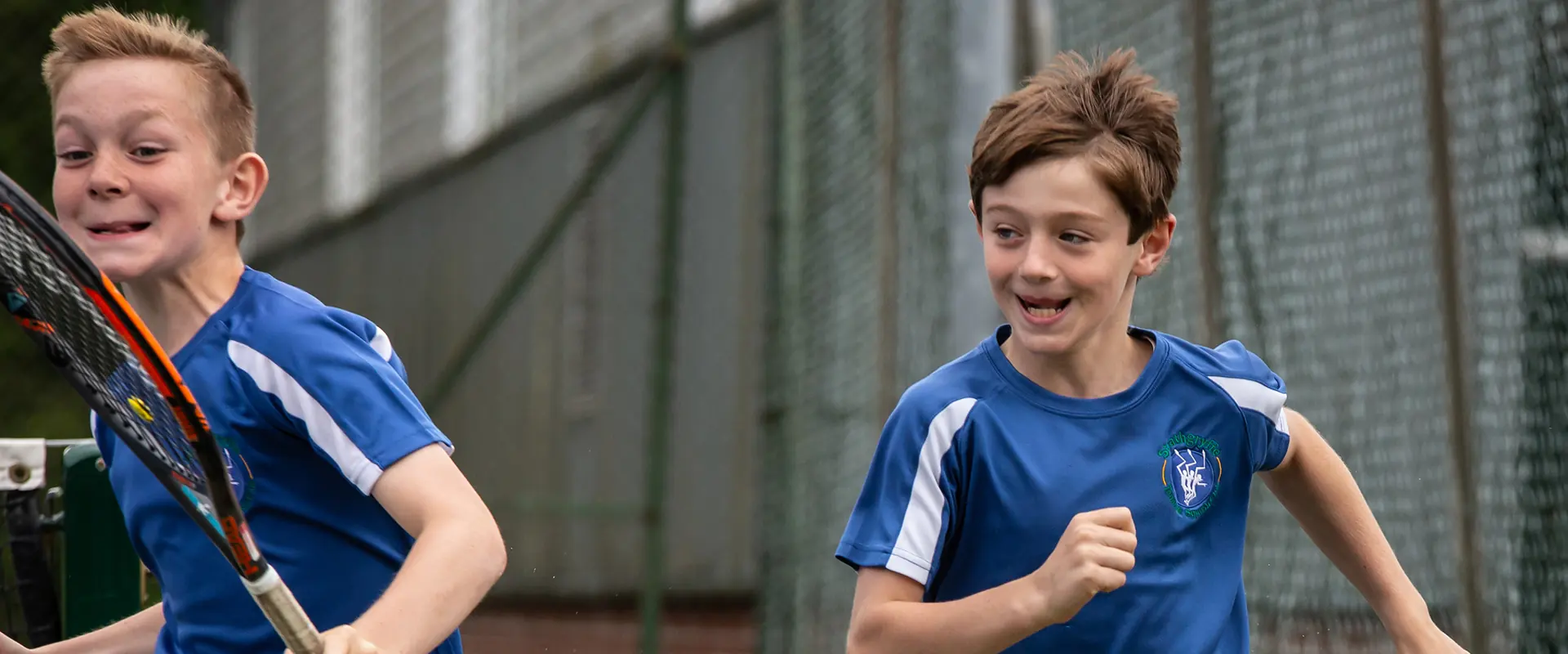 Junior players racing across a court